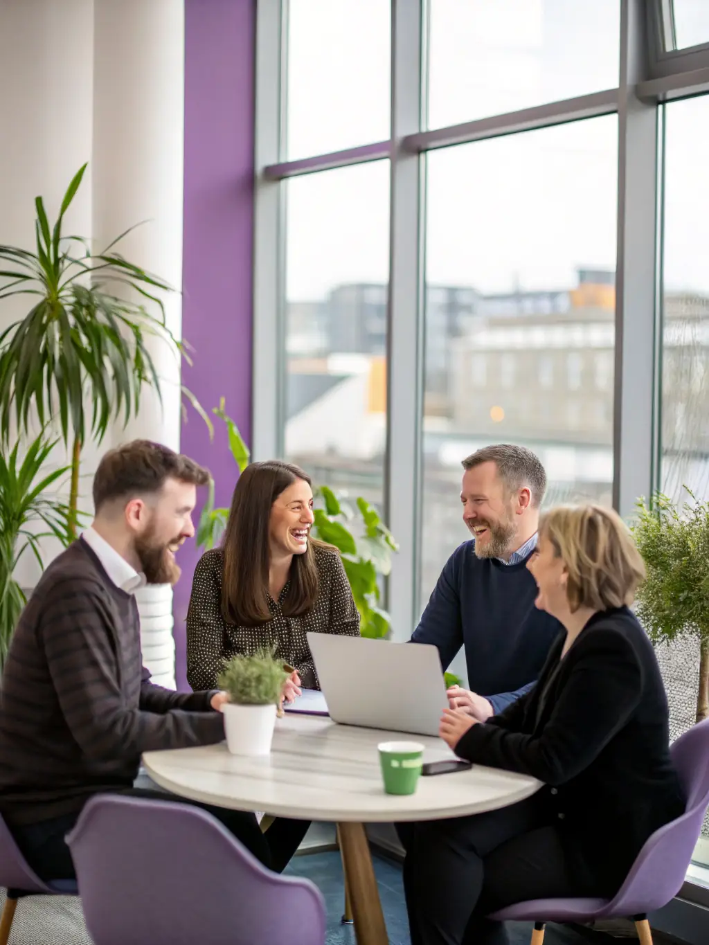 A diverse group of South African entrepreneurs collaborating on financial strategies in a modern co-working space, symbolizing community and growth.